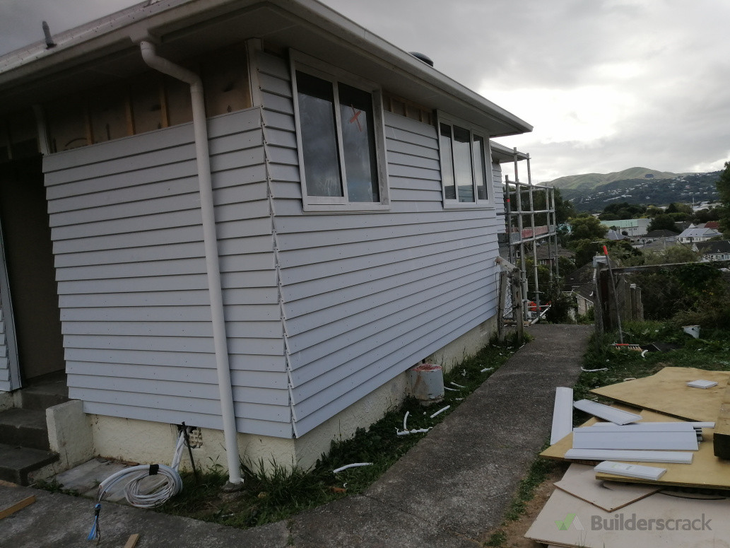 Installed new windows and reclad the exterior with bevel-back weatherboards
