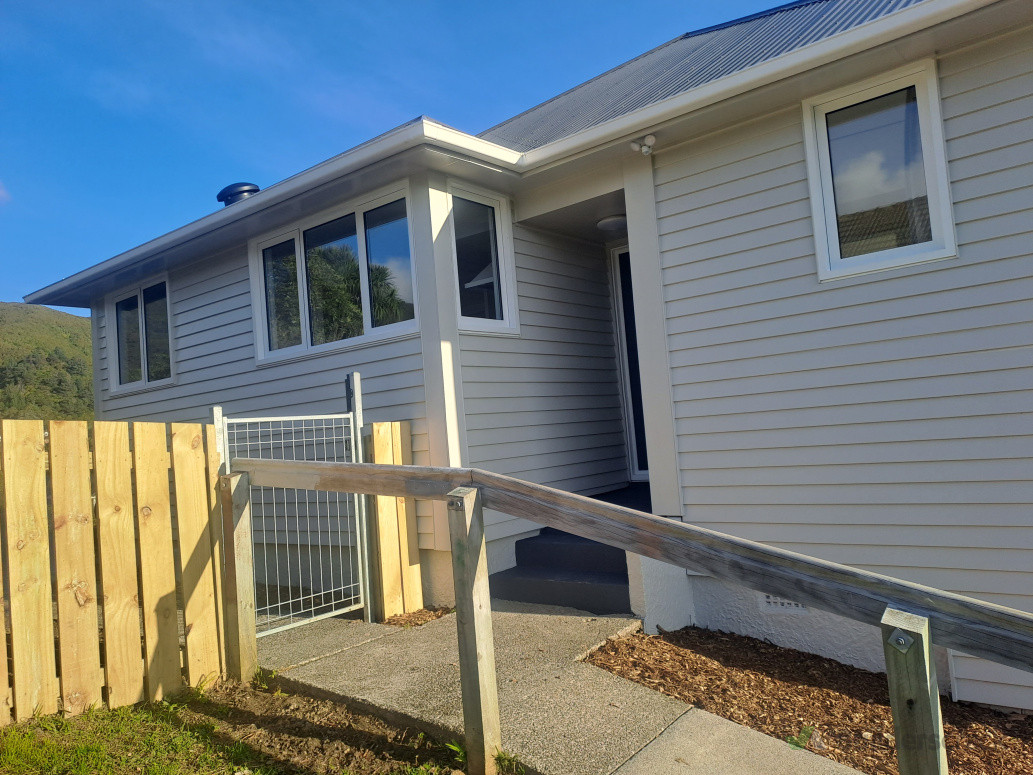 Installed new windows and reclad the exterior with bevel-back weatherboards.