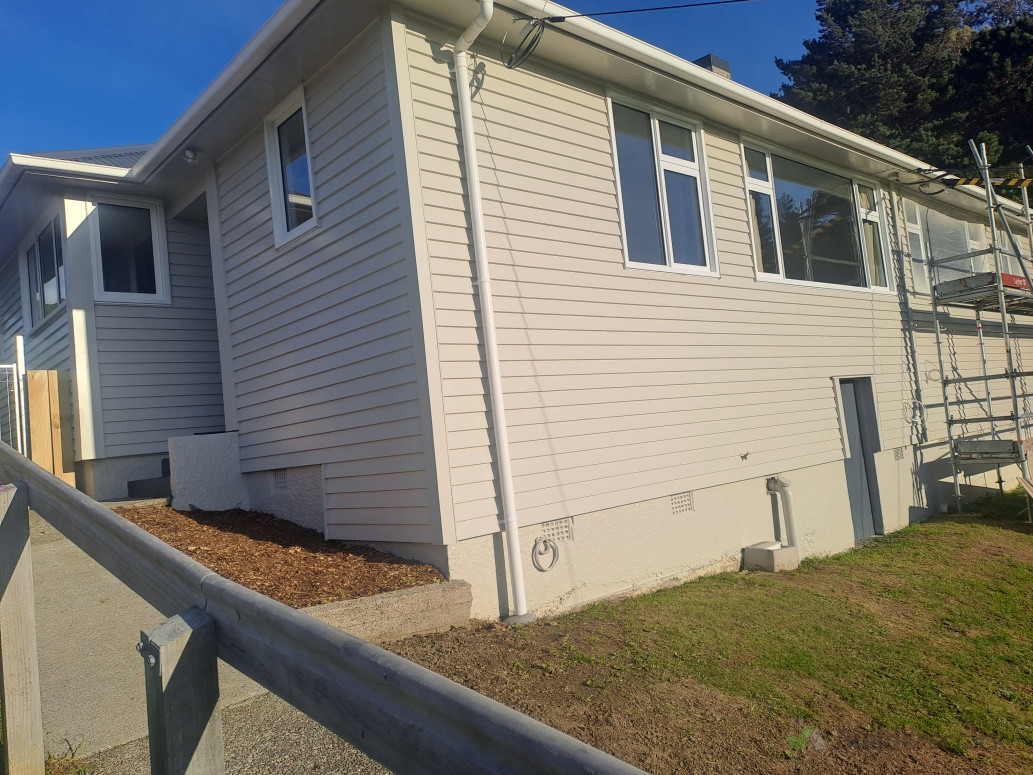 Installed new windows and reclad the exterior with bevel-back weatherboards.