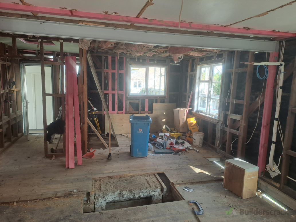 Removed a load-bearing wall and fireplace, and installed a 5-meter structural steel beam to support the open-plan layout.