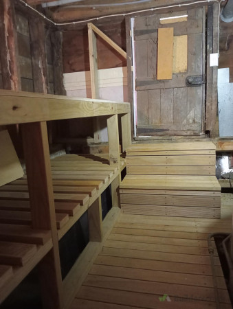 View from the back wall with steps up to entrance