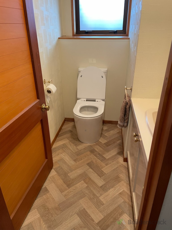 End result of new linings behind toilet due to water damage,new vinyl.