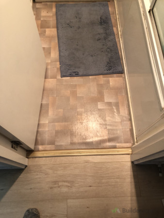 Old vinyl floor and rotten floor underneath.