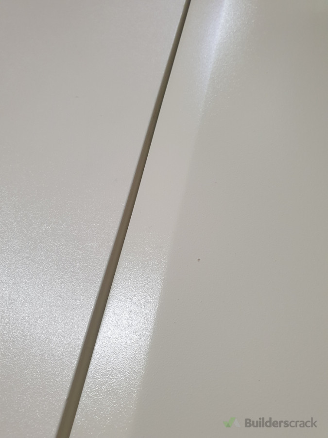 Respray of some kitchen draws which the original plastic coating had come unstuck . left is piece of original coating, Right is original  draw resprayed