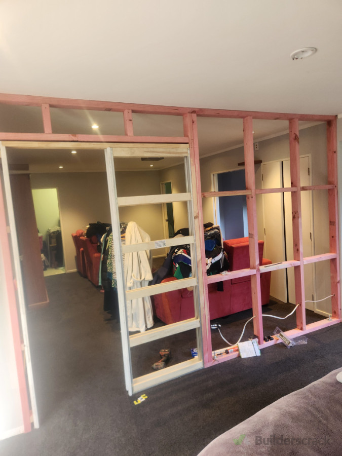 Built a wall in this downstairs Rumpus/lounge to convert half into a bedroom.Client chose a cavity slider.Good space saver.Nice little job ready for plastering and paint.