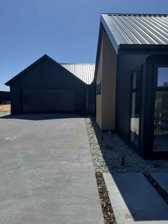 Concrete with stone mulch and planting