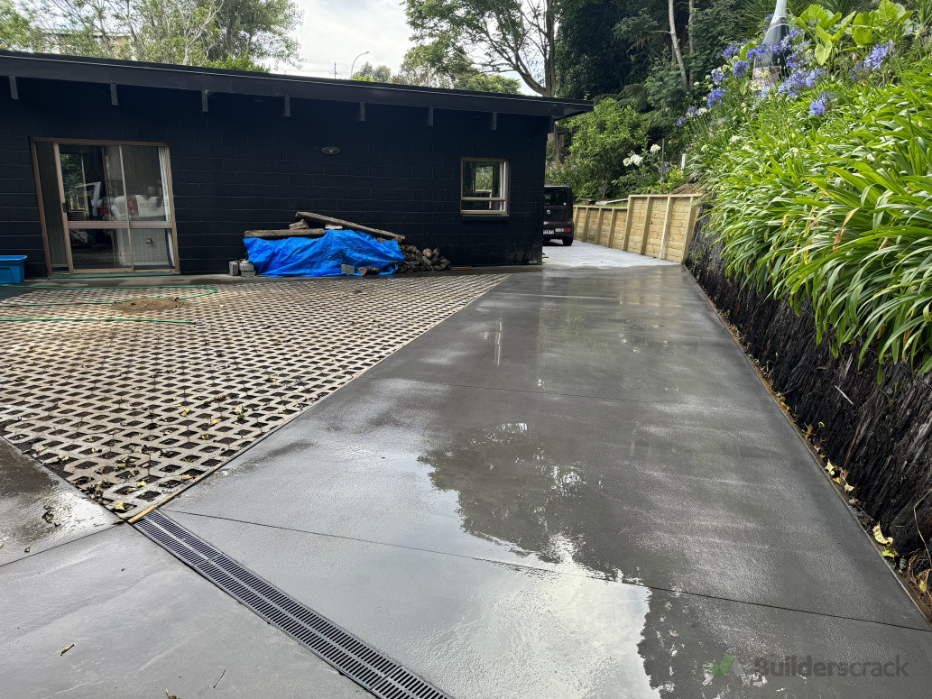 Concrete drive alongside firth grass pavers