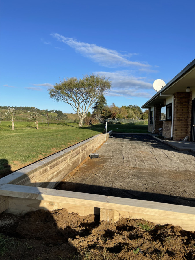 Small retaining wall with concrete prep