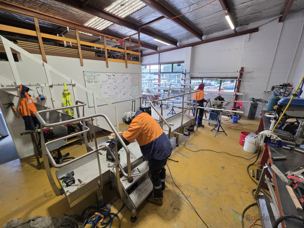 Welding and fabrication of new stainless steel platform and handrails.