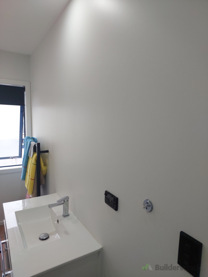 Work in progress, old mirror was removed, bathroom painted