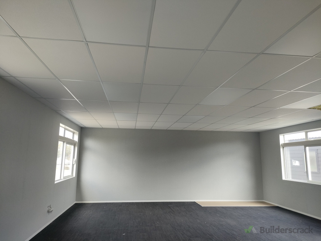 Two way ceiling grid and tiles and autex wall coverings.