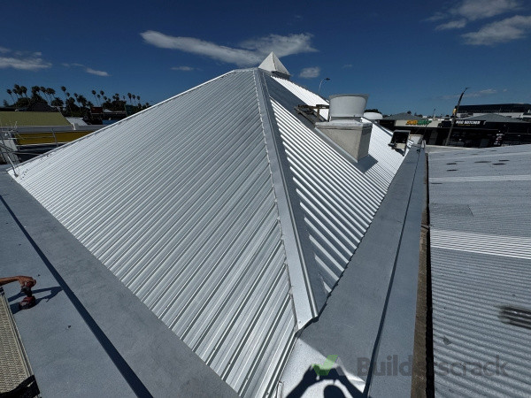 "Commercial re-roof using Superdek profile and internal guttering – a robust solution for long-term protection."