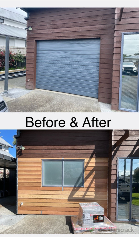 Away with this damaged garage door and in comes an additional room. The left side got an entry door.