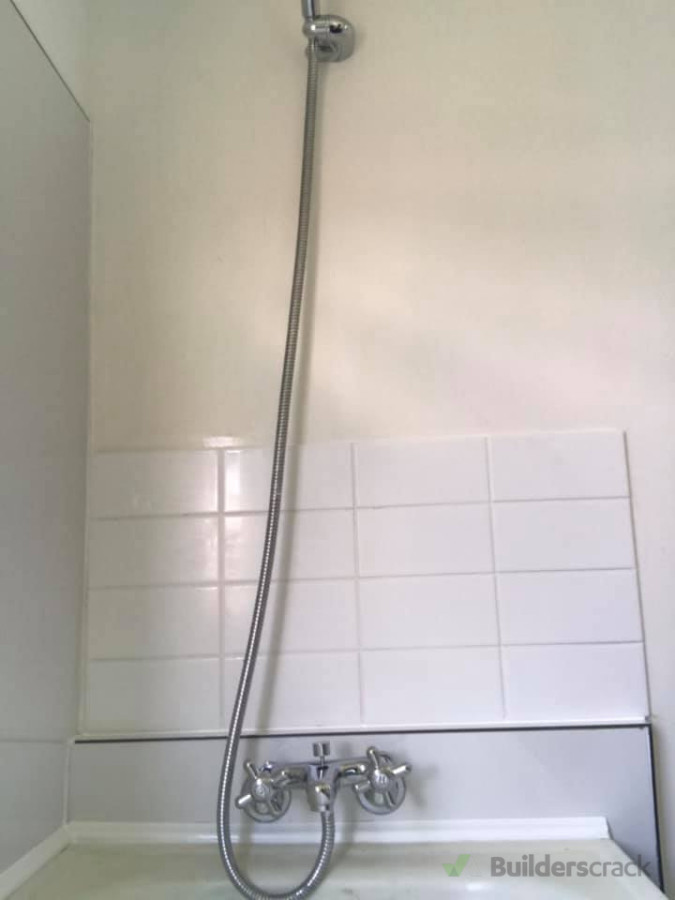 rotting wall and gib all replaced lined with tiles and seratone