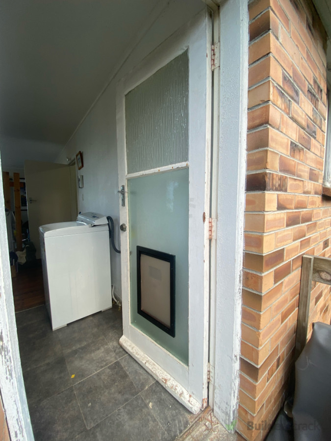 Turned a 3 bay door into 2 bay for  large dog door to fit