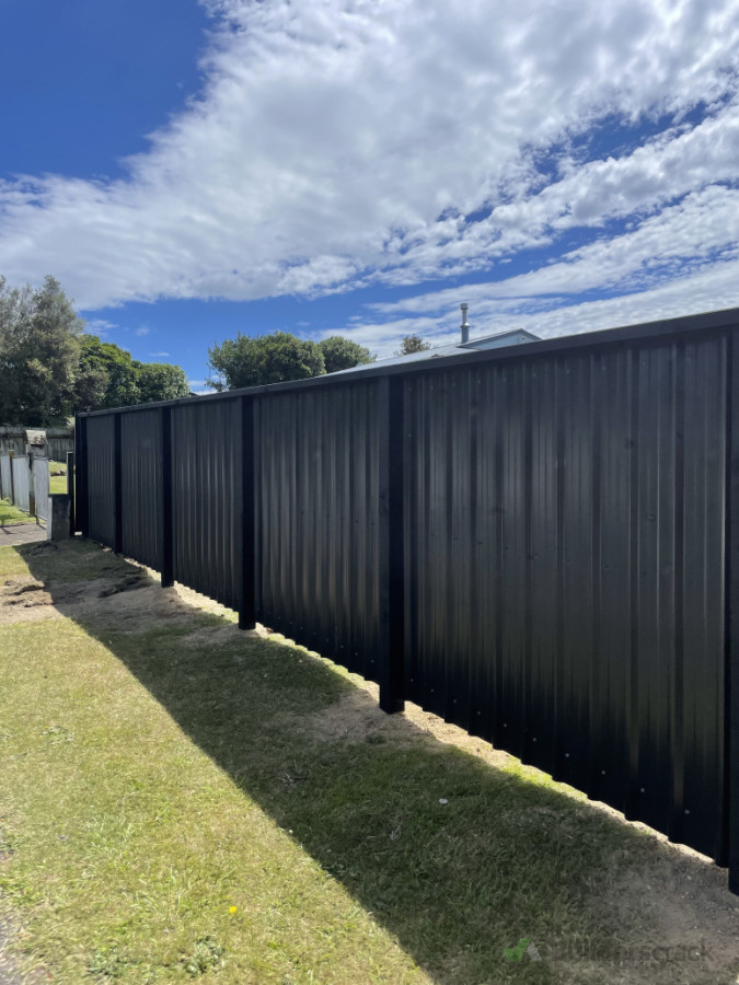 New fence, colour steel and wood.