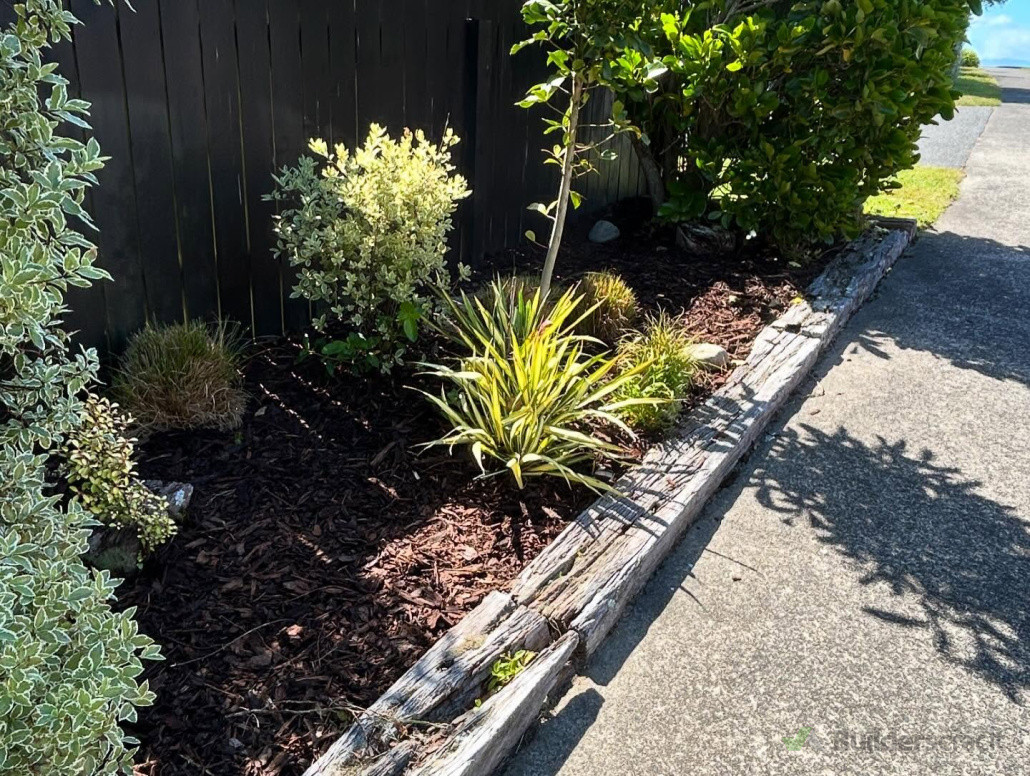 Weeded and cleared, topped with fresh bark.
