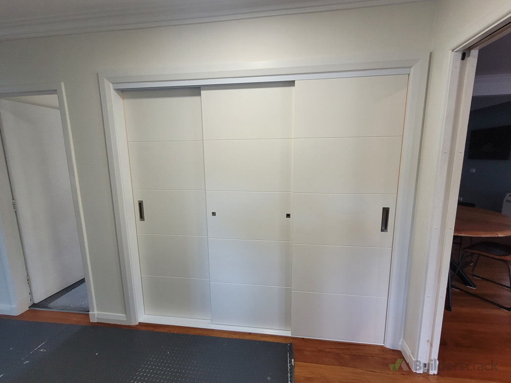 Conversion of two small Wardrobes into one large pantry with triple sliding doors in lower hutt
