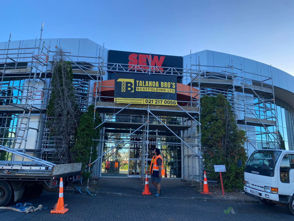 Commercial scaffolding for painter access.