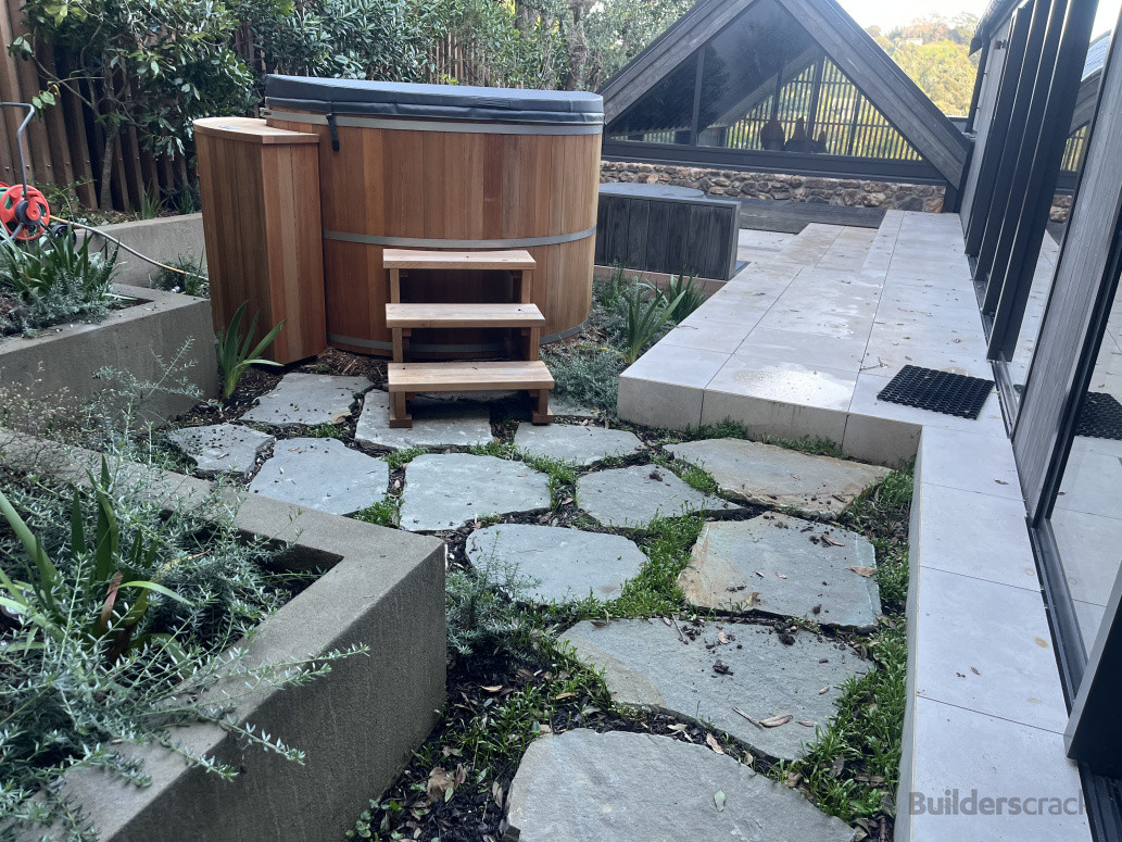 Paradise stone steppers, block walls, tiling, spa set up and base, ground cover and plant install.