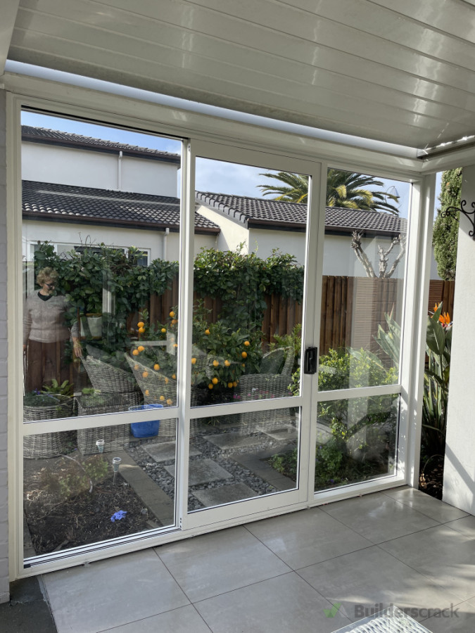 Windbreaker with sliding door