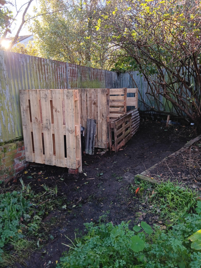 Side view of new composting area. Screws and nail plates used to secure pallets together