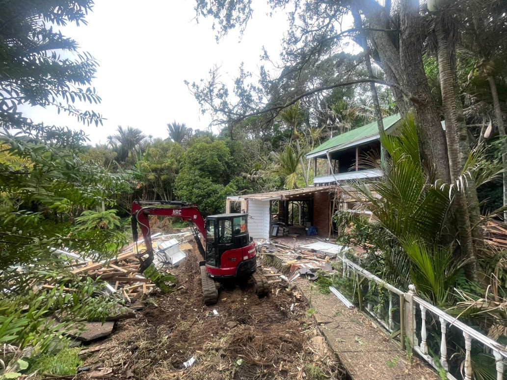 Our trusty 5T Digger working hard to deconstruct another house in Muriwai