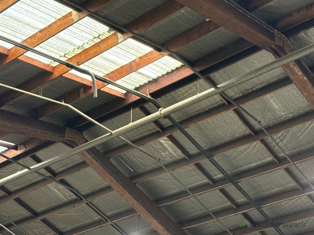 Gasket to high level ipework below fibre cement roof