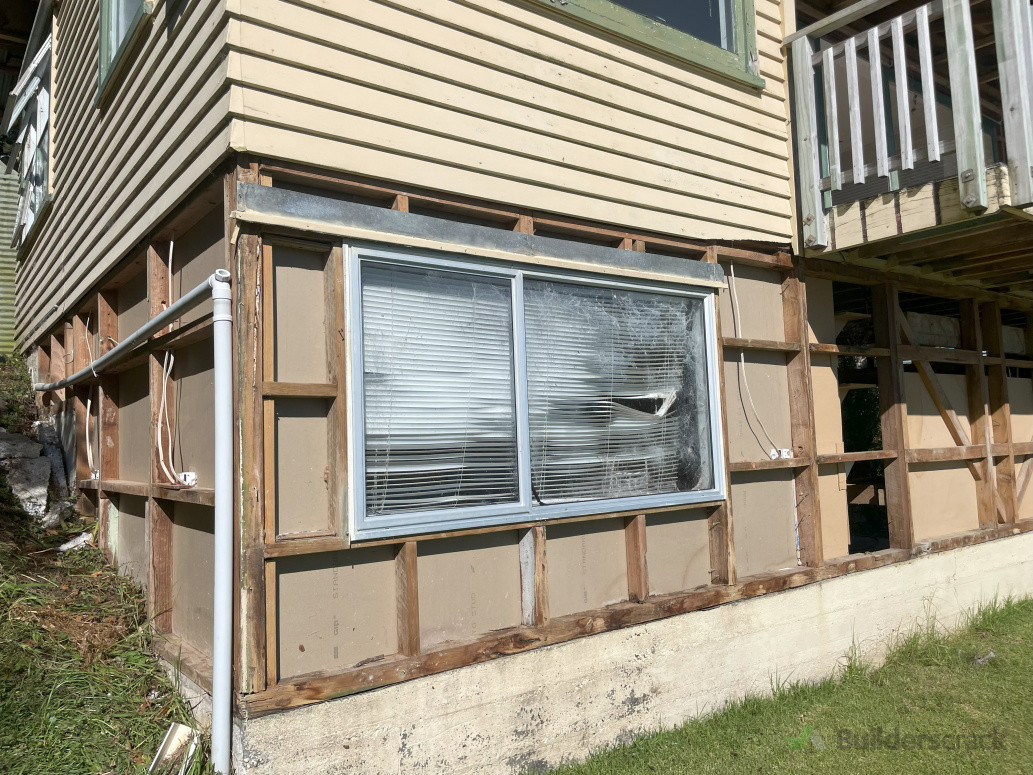 Removed fibre cement cladding from ground floor