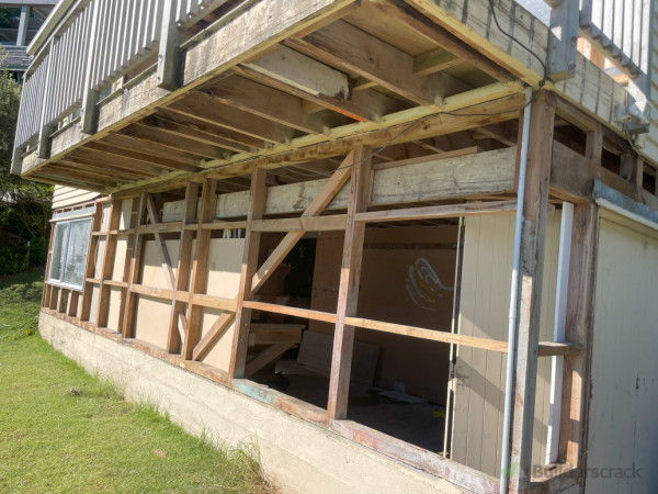 Removed fibre cement cladding and deck lining from ground floor
