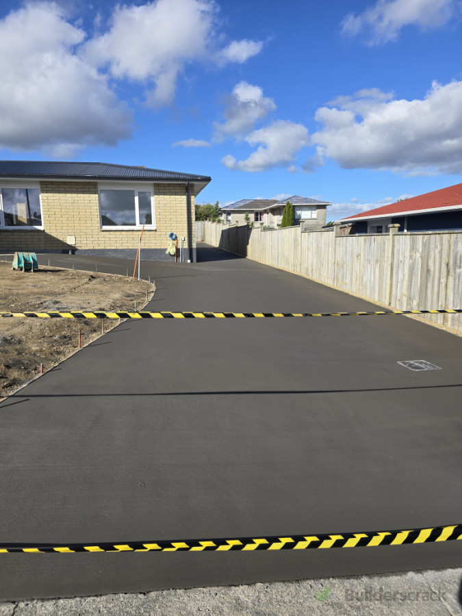 Half black, broom finish concrete driveway