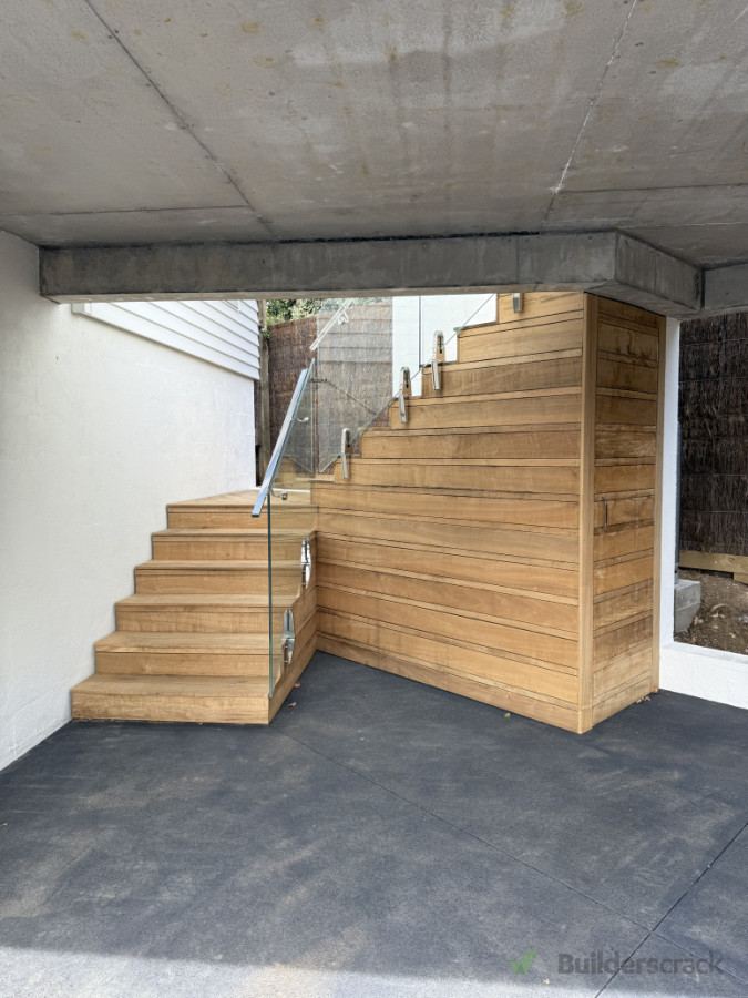 Custom built deck with storage + glass balustrade and handrail