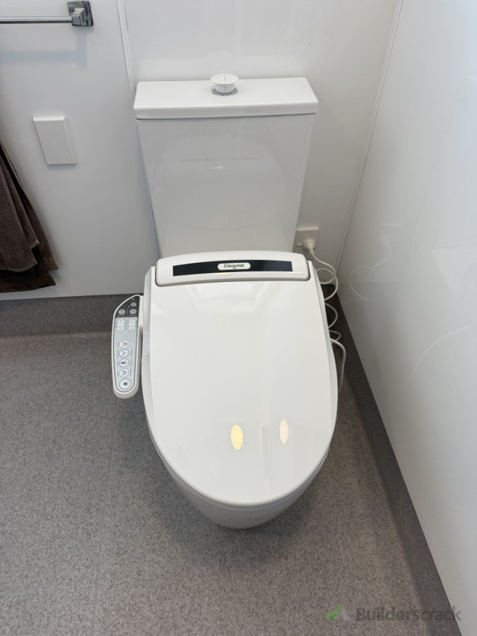 Accessible toilet with bidet seat