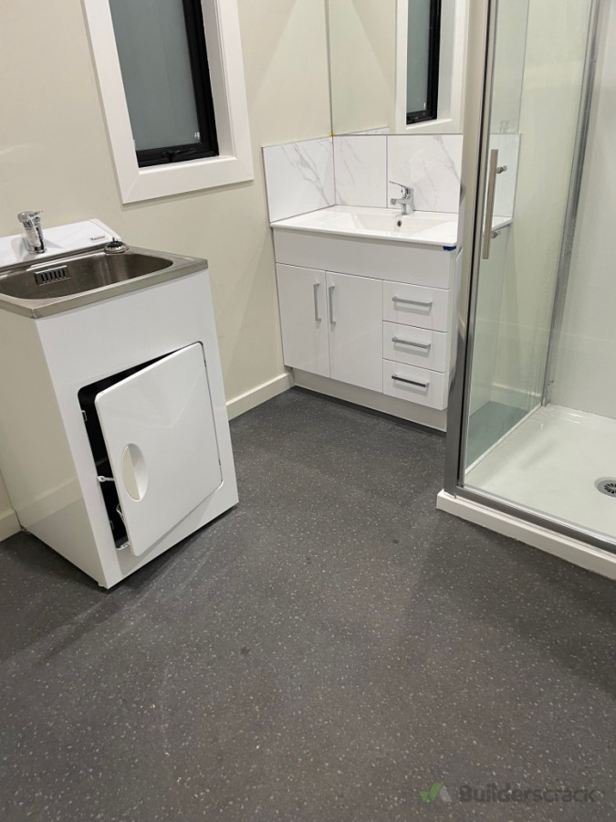 New sheet vinyl install in rental property renovated bathroom