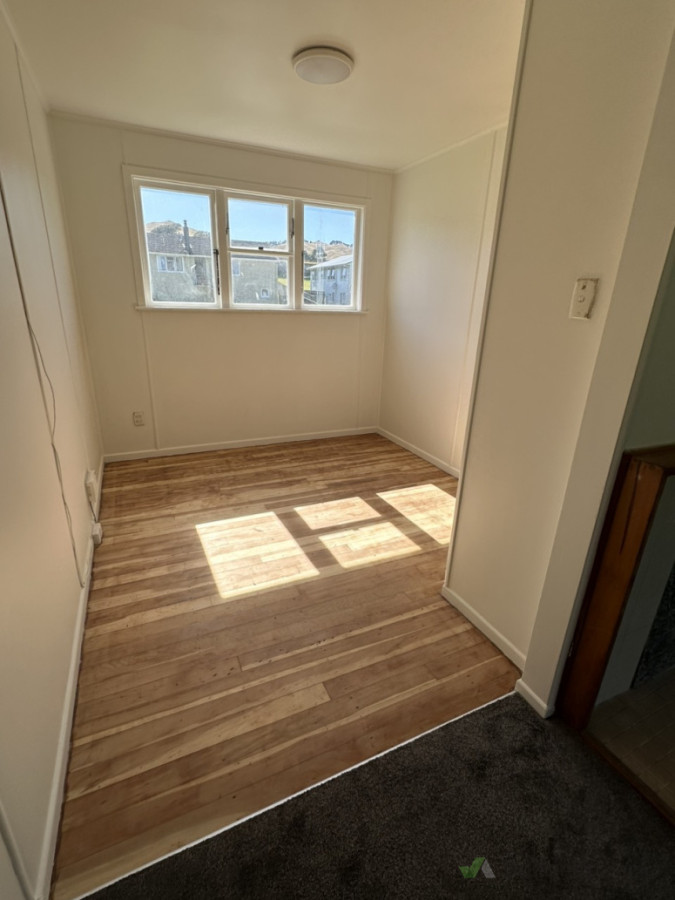 Sand and polyurethane dining room and kitchen in renovated rental property