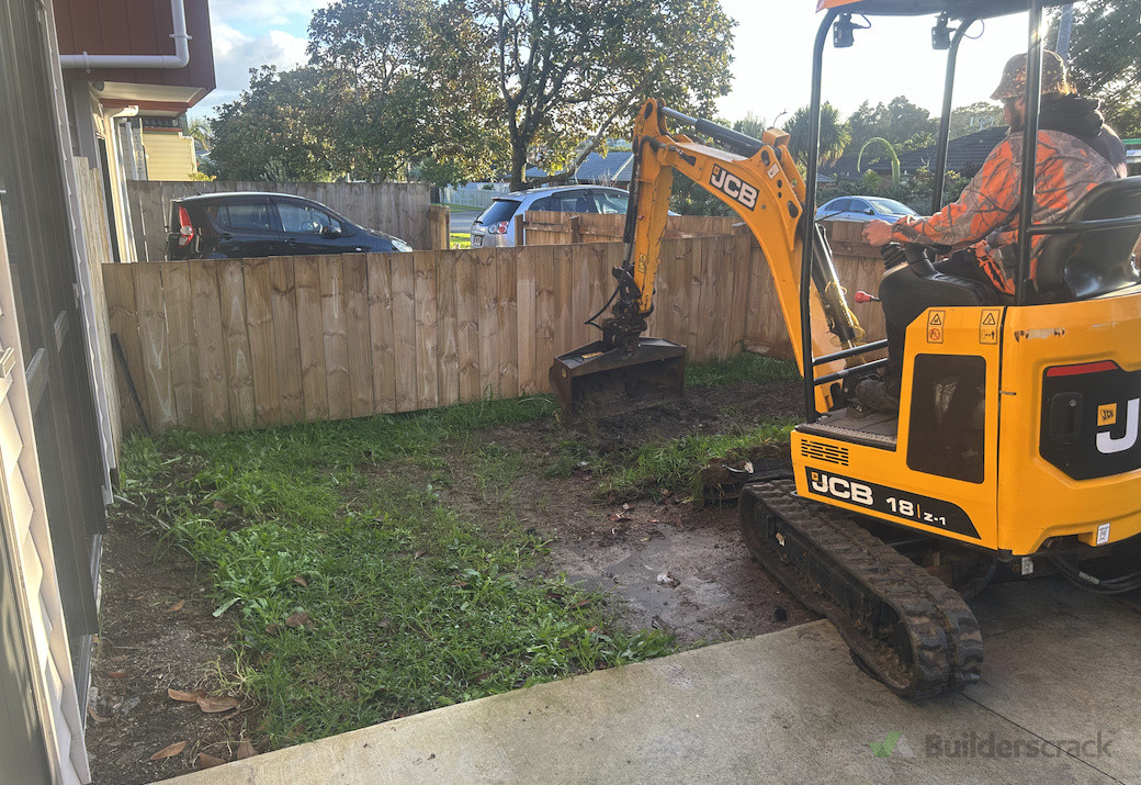 Before - other side of driveway, muddy and unused area causing the customer headaches