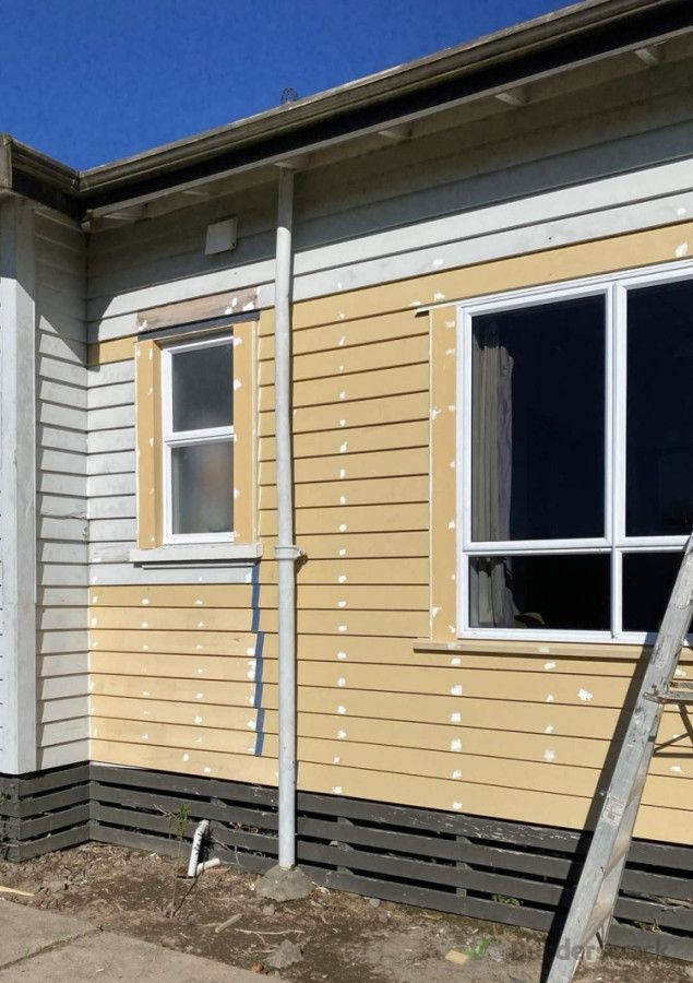 Timber window and weatherboard repair