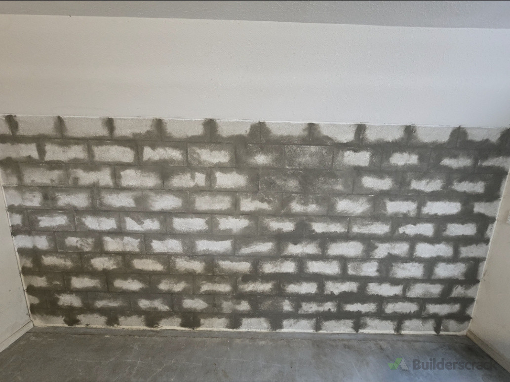 Filled the mortar with a crystalline product to help the mortar become stronger and to make the wall flush for plastering