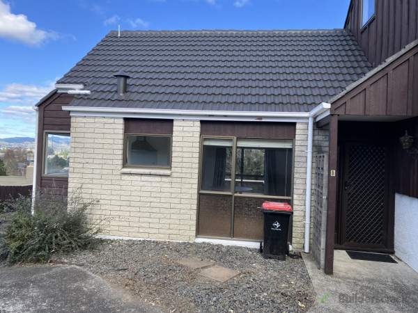 Cabbage trees removed and new gutters and down pipes