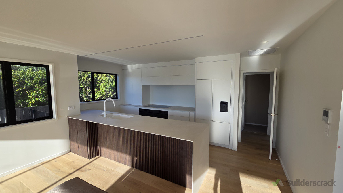 Beautiful new modern high quality kitchen, featuring 12mm porcelain waterfall benchtop