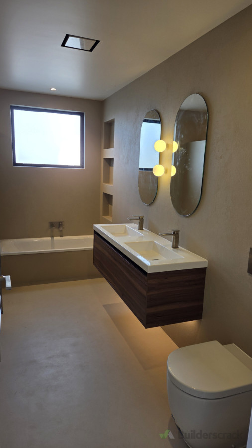 New high end bathroom with modern fittings and micro cement walls and floor