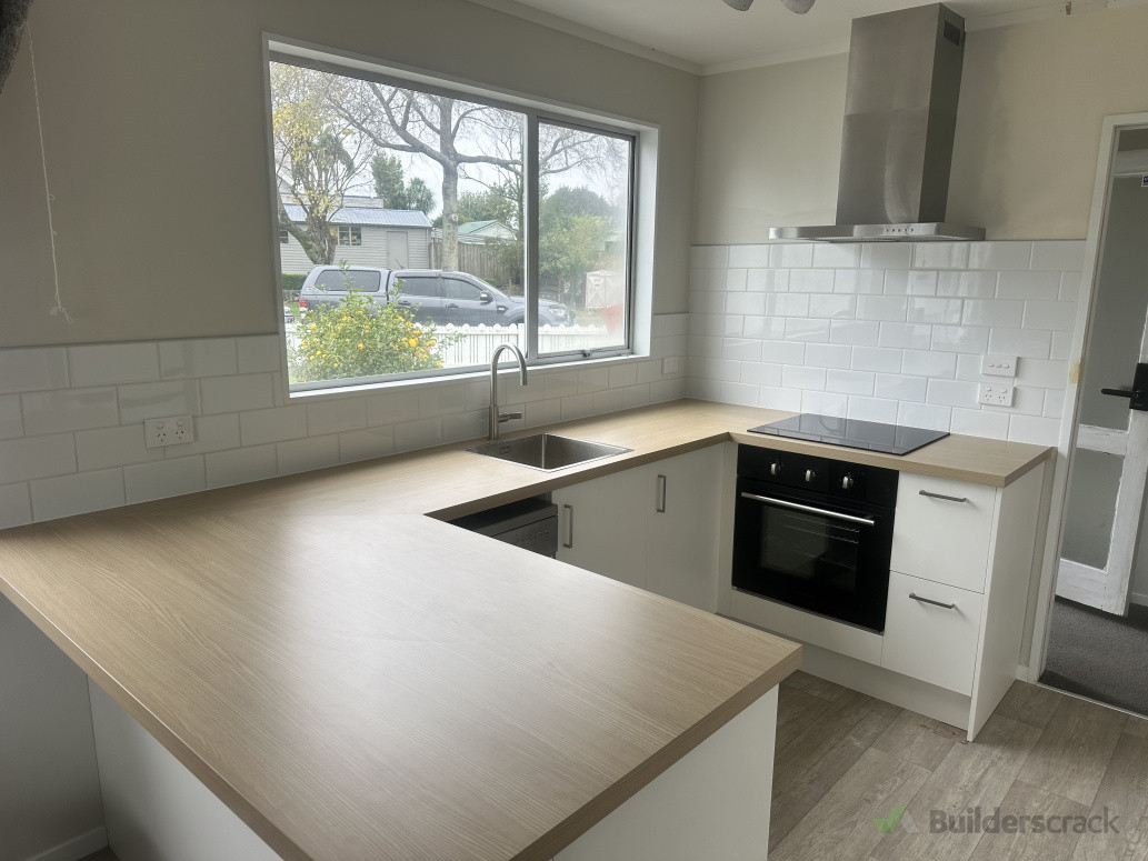 A brand new Kitchen, a super clean modern look for our very happy clients.