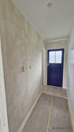 Skim coat of plaster to get the walls smooth and even