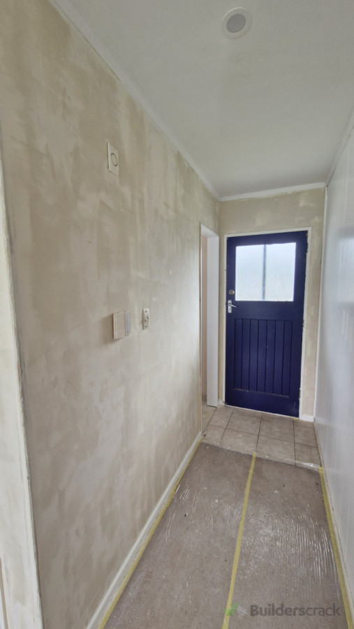 Skim coat of plaster to get the walls smooth and even