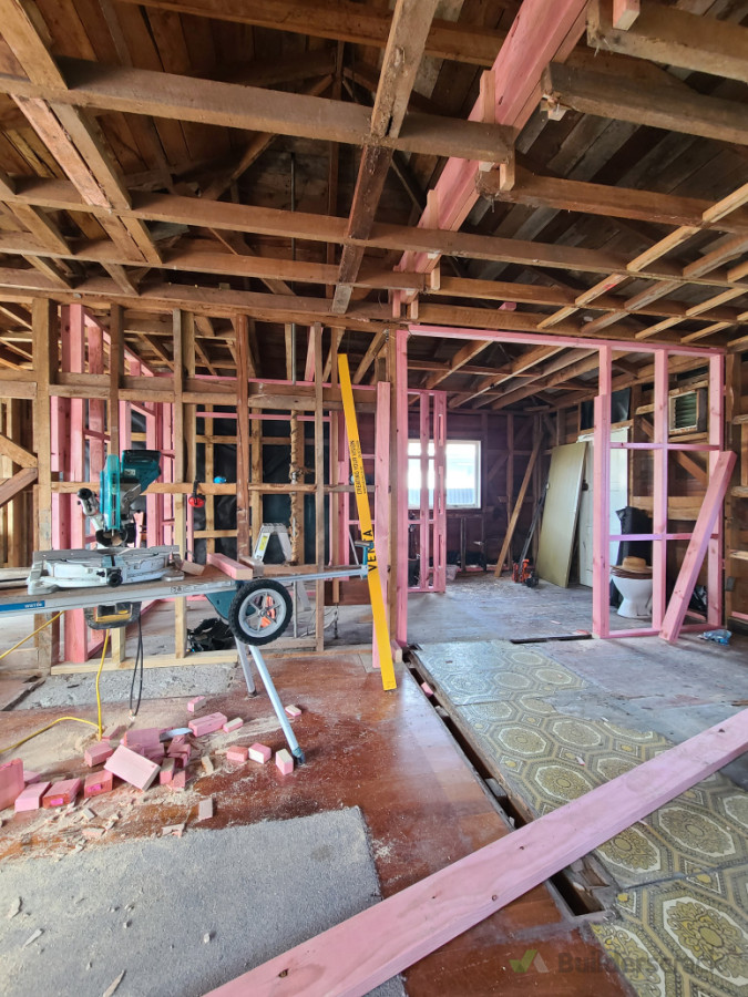 New ceiling beam installed to create open living. Remove/install/straightening walls