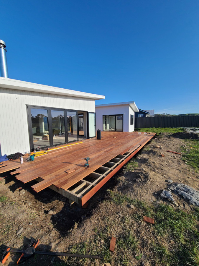 Kwila decking going down.