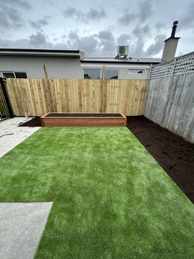 Raised garden bed, artificial turf and fence