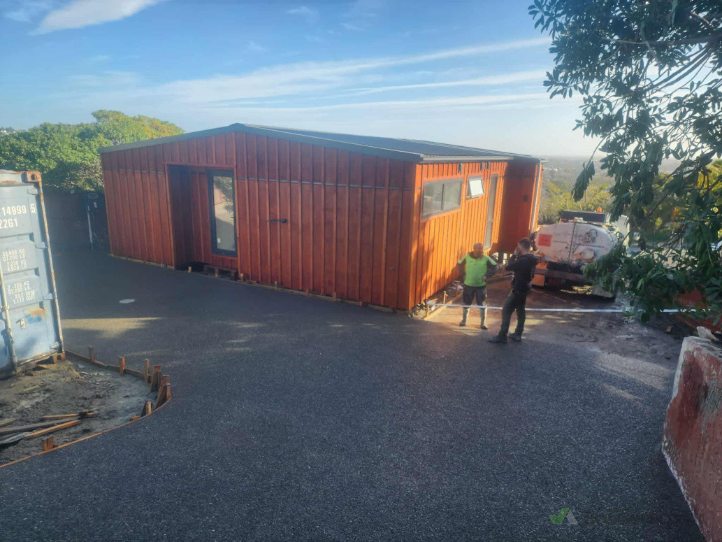New concrete driveway and completion of Board and battern house