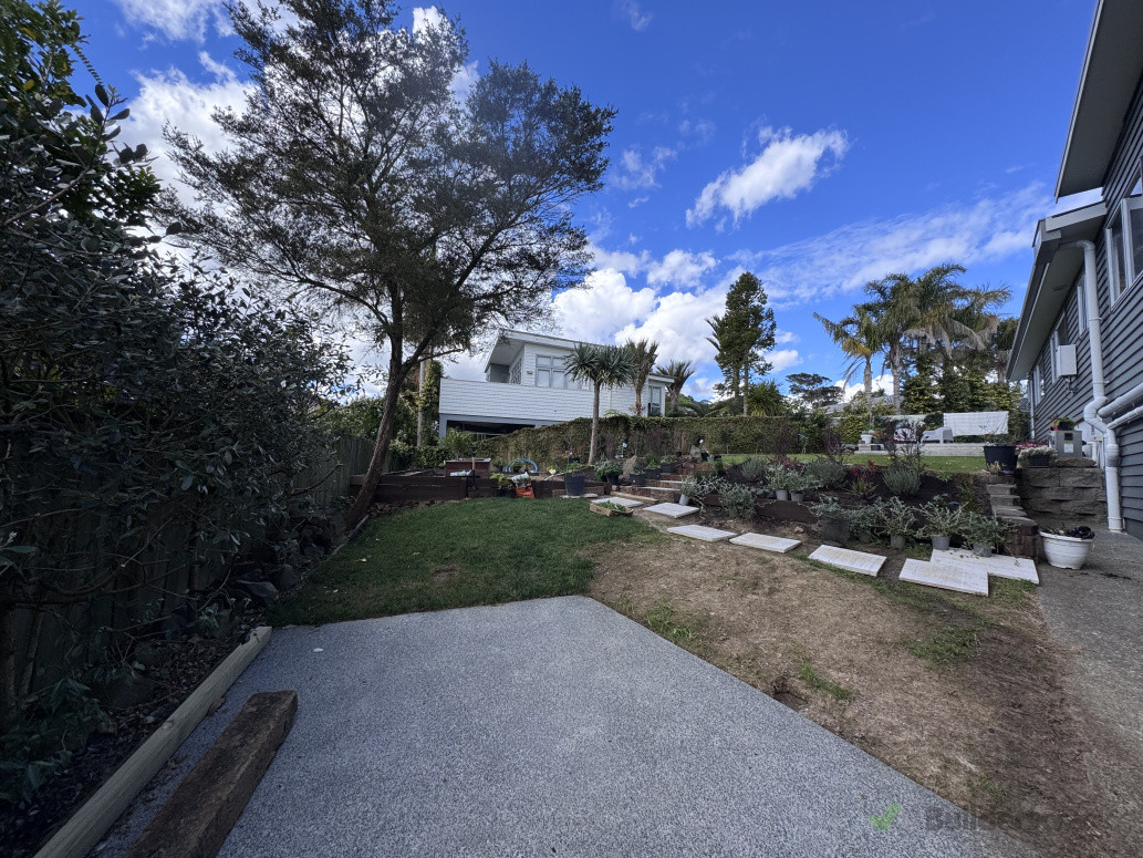 After reshaping of lawn and addition of concrete pad