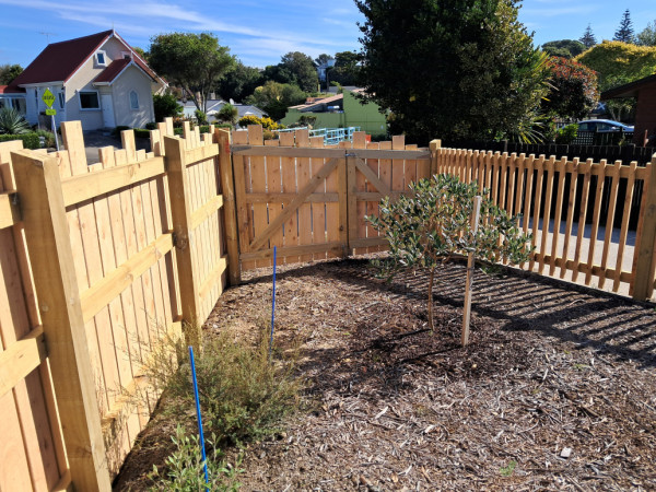 Angled double gate following the fall between the main fence and balustrade sections